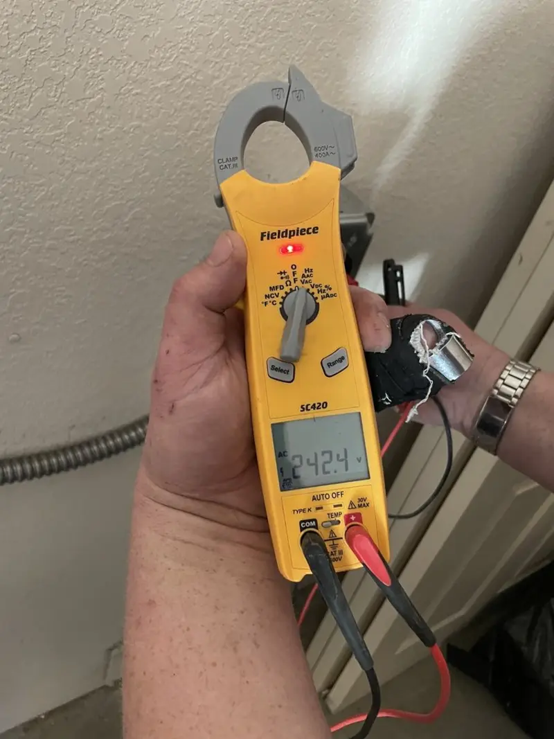 Voltage testing with clamp meter during Generator Installation in Brownsburg
